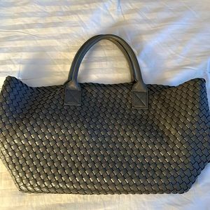 Looks like a Bottega Venetta designer satchel